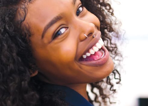 Young girl smiling after hygienist treatment